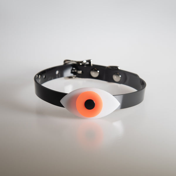 Apatico eyeball choker collar in uv neon orange for Pride.