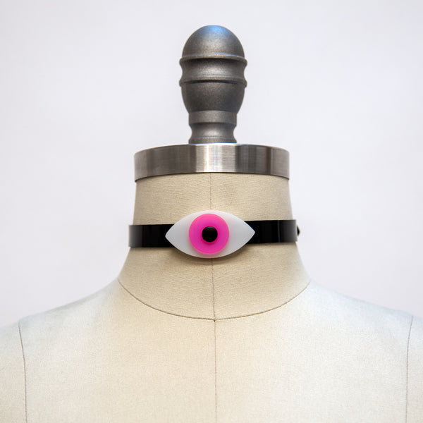 Apatico eyeball choker collar in pink, on a dress form mannequin, for Pride.