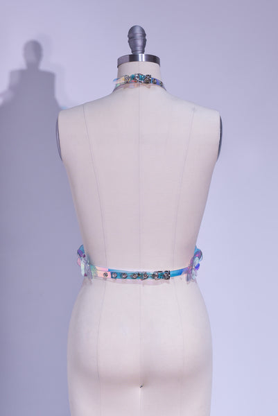 Rainbow, iridescent, holographic roses fashion  harness. Ornate, sculptural, three-dimentional floral harness displayed on a professional dressform.