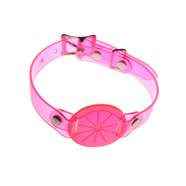 Apatico and Anhedonie choker collar in neon uv pink with acrylic citrus center.