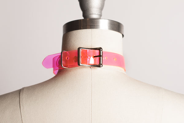 Apatico and Anhedonie choker collar in neon uv pink with acrylic citrus center.