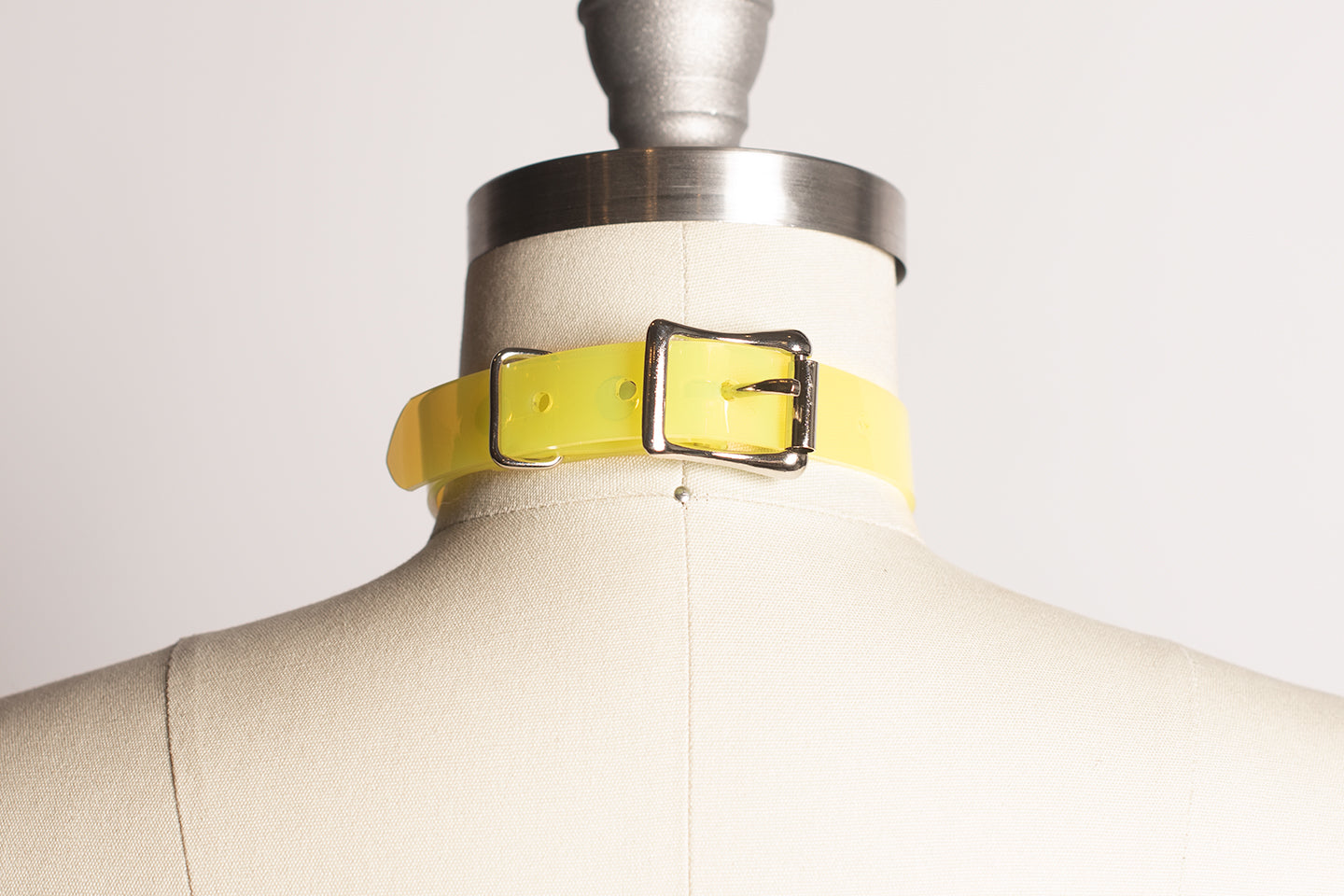 Apatico and Anhedonie choker collar in neon uv yellow with acrylic citrus center.
