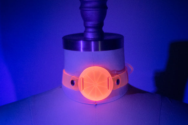 Apatico and Anhedonie choker collar in neon uv pink with acrylic citrus center.