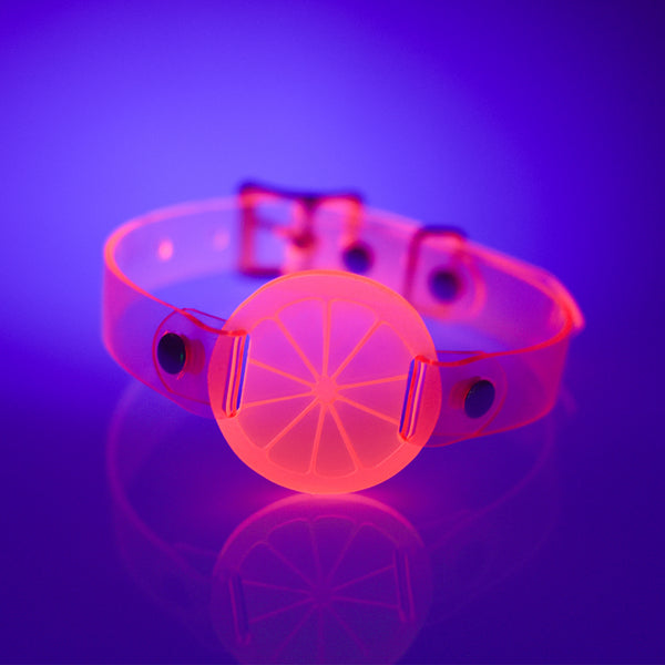 Apatico and Anhedonie choker collar in neon uv pink with acrylic citrus center.