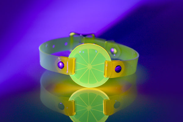 Apatico and Anhedonie choker collar in neon uv yellow with acrylic citrus center.