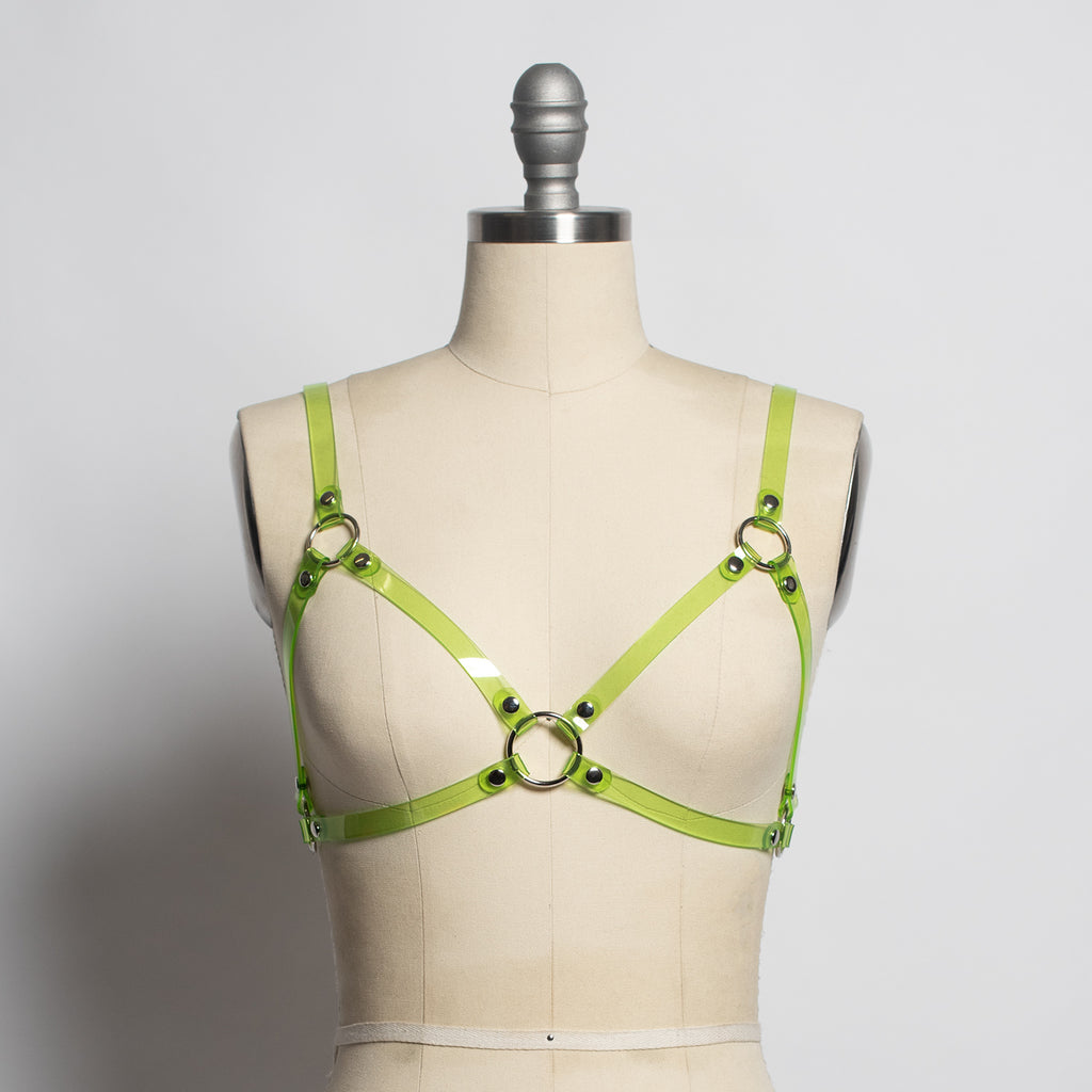 https://www.apatico.net/cdn/shop/products/apatico-cage-bra-harness-top-lime-green-clear-pvc-translucent-plastic-fetish-fashion-clubkids-gothic-style_1024x1024.jpg?v=1542883951