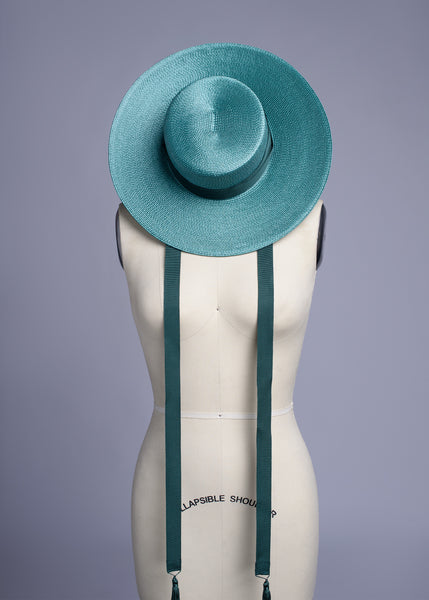 Deep teal green wide brim hat with green grosgrain ribbon ties and tassels.