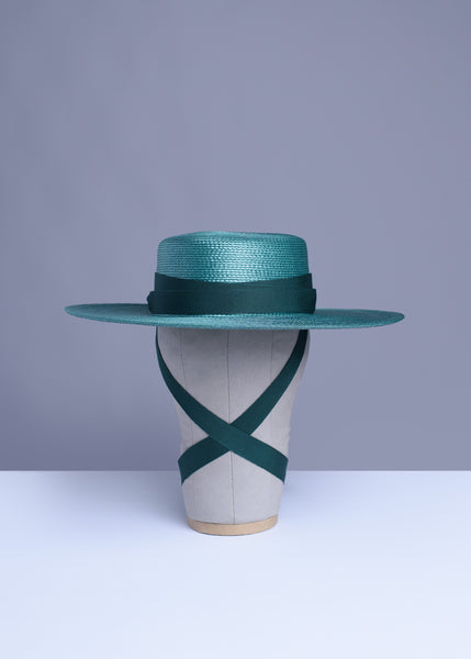 Deep teal green wide brim hat with green grosgrain ribbon ties and tassels.