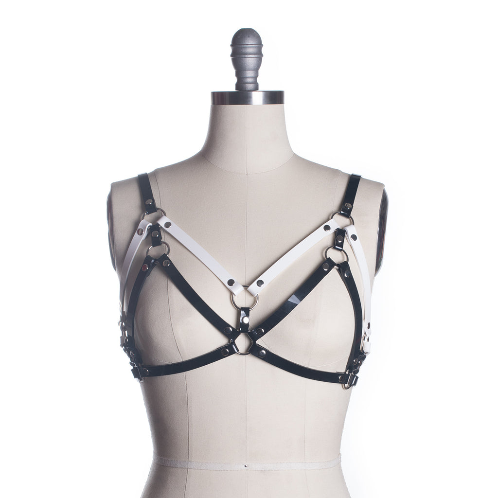 https://www.apatico.net/cdn/shop/products/apatico-harness-bra-black-white-chevron-black-lodge-twin-peaks-inspired-cage-gothic-seattle-fashion-designer-colorblock-fw2017-crop_1024x1024.jpg?v=1523207092