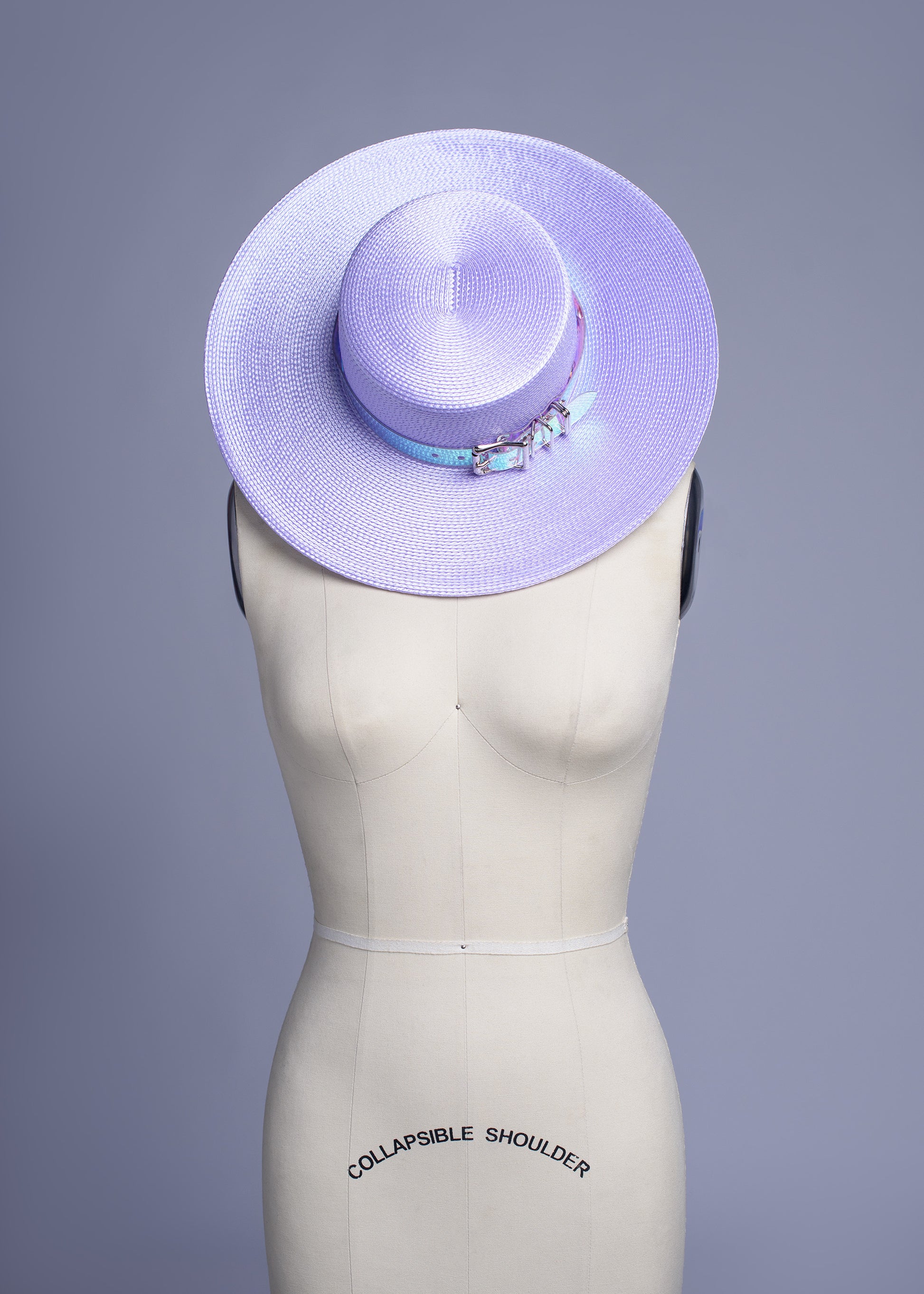 Apatico wide brim harness hat in pastel lavender with an iridescent, holographic pvc buckle band and harness straps.