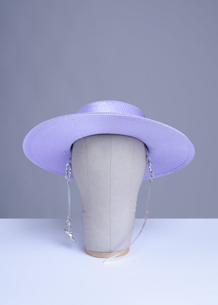 Apatico wide brim harness hat in pastel lavender with an iridescent, holographic pvc buckle band and harness straps.