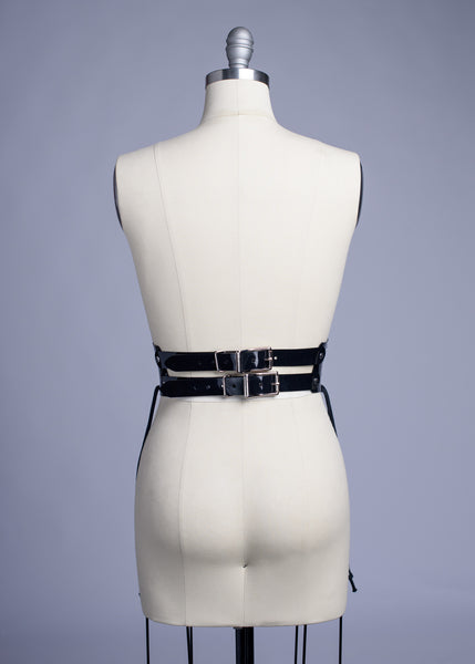 Black PVC lace up Corset style waist belt displayed on dress form.