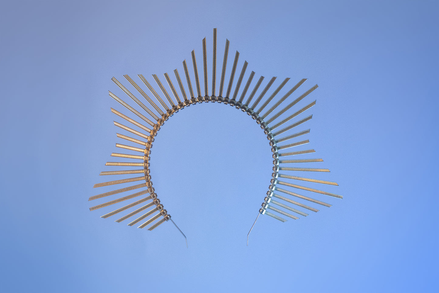 Star shaped halo crown headpiece made out of gold zip ties by Apatico.