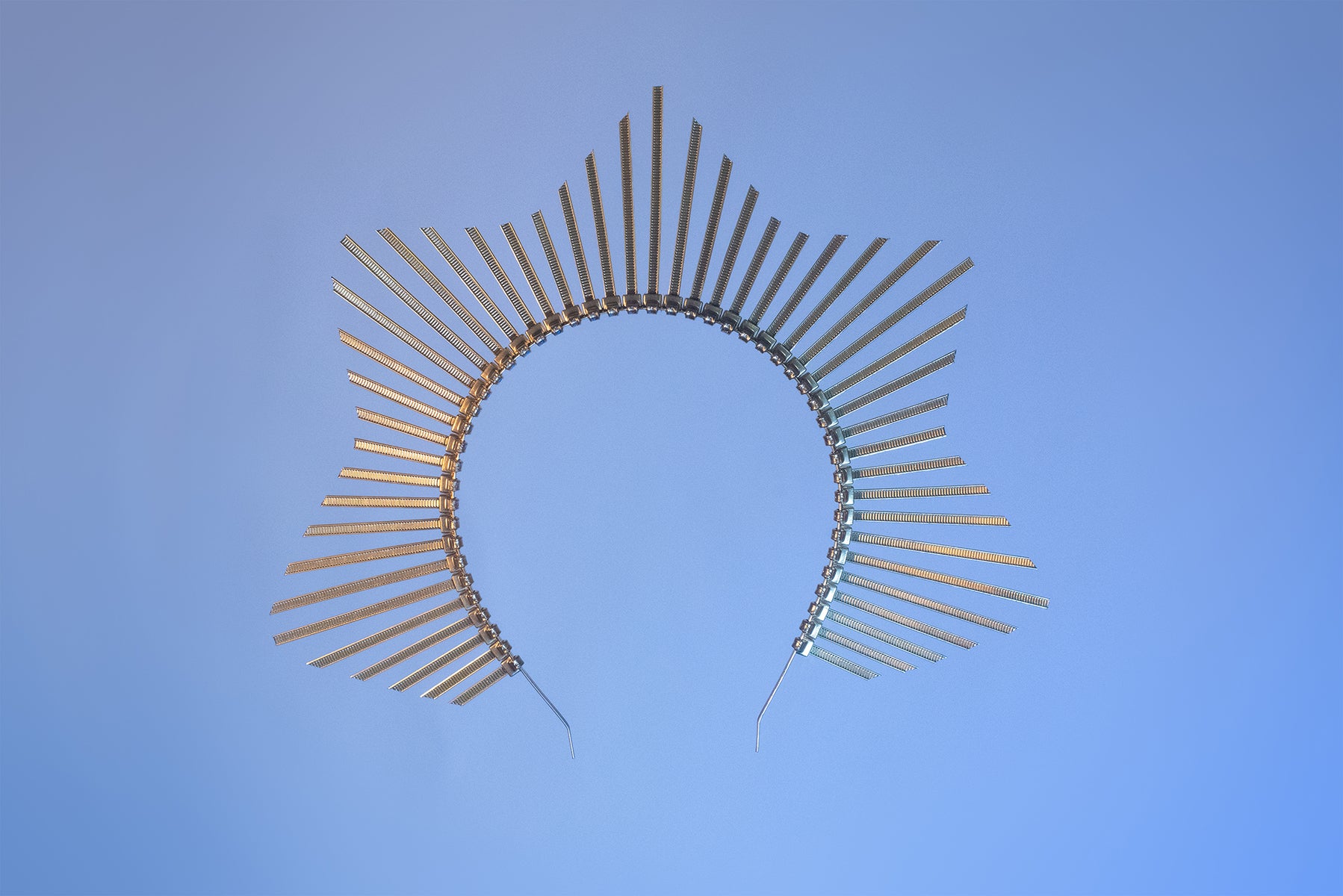 Star shaped halo crown headpiece made out of gold zip ties by Apatico.