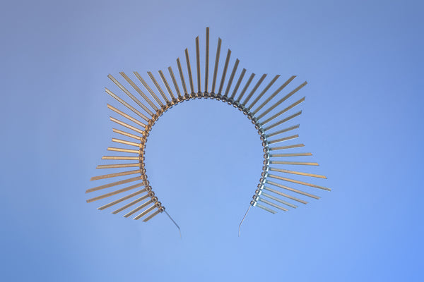 Star shaped halo crown headpiece made out of gold zip ties by Apatico.