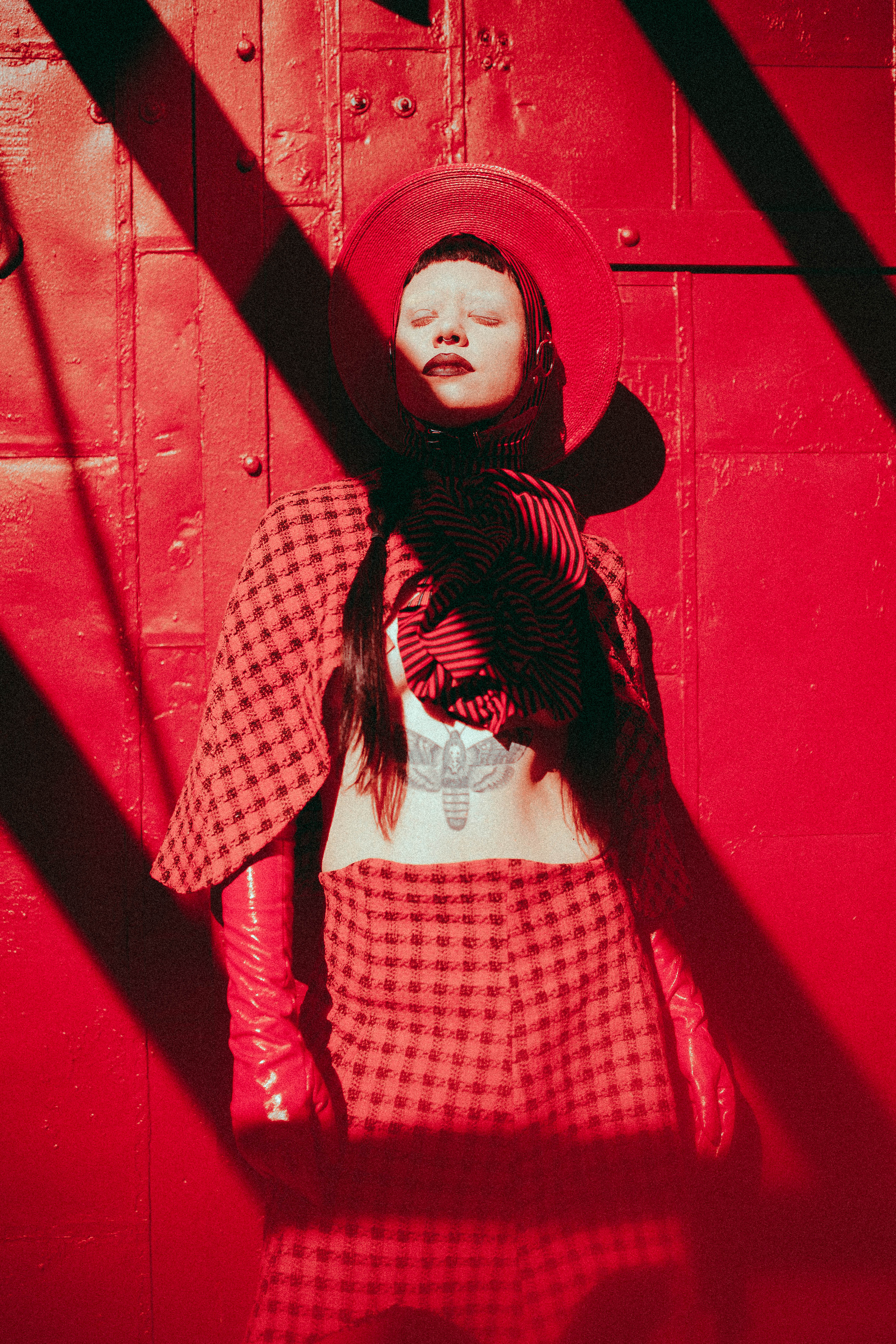 Red straw harness hat with buckle details - photography by Emma Wondra - Clothing by Samantha Rei.