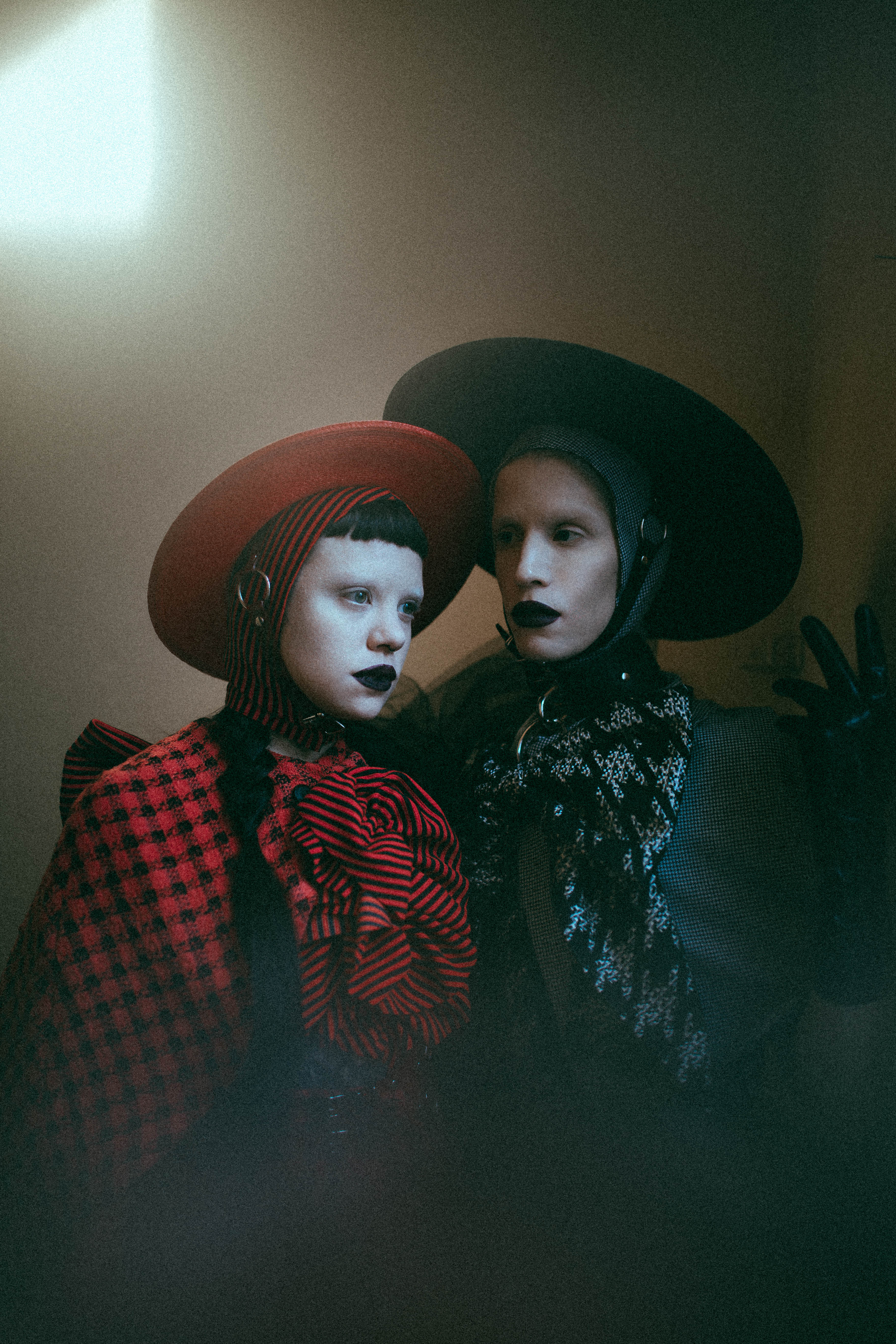 Black and red straw harness hat with buckle details - photography by Emma Wondra - Clothing by Samantha Rei.